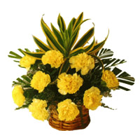 Christmas Flowers in Mumbai that includes Yellow Carnation Basket of 12 Flowers in Mumbai