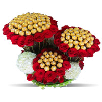 Deliver Diwali Gifts to Mumbai encircled 96 Pcs Ferrero Rocher 200 Red White Roses Bouquet