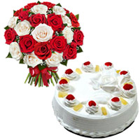 New Year Cakes to Mumbai comprising 1 Kg Pineapple Cake and 24 Red White Roses Bouquet