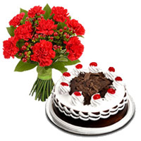Christmas Flowers in Mumbai incorpoarte with 12 Red Carnation 1/2 Kg Black Forest Cake to Mumbai
