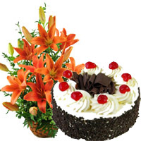 Send Christmas Gifts to Mumbai take in 12 Orange Lily Arrangement 1 Kg Black Forest Cake in Mumbai