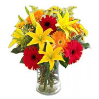 Christmas Flowers Delivery in Mumbai having Lily Gerbera Bouquet in Vase 12 Flowers in Mumbai