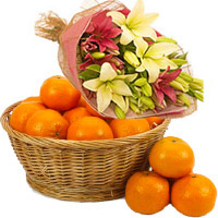 Send Bhaidooj Gifts to Mumbai including Pink Yellow Lily Flower Bouquet with 4 Flower Stems with 18 pcs Fresh Orange