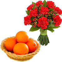 Send Christmas Gifts to Mumbai consisting 12 Red Carnations Bunch with 12 pcs Fresh Orange