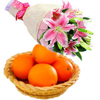 Send Bhaidooj Gifts in Mumbai Comprising Pink Lily Flower Bouquet in Mumbai with 3 Stems and 12 pcs Fresh Orange