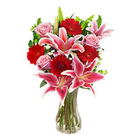 Place Order to Send New Year Flowers to Pune of 4 Pink Lily 4 Pink Rose 4 Red Gerbera in Vase in Mumbai