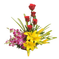 Christmas Flowers in Mumbai containing 2 Yellow Lily 4 Orchids 5 Red Rose Basket in Mumbai