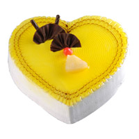 Order Cake Online Mumbai Midnight Delivery that includes 3 Kg Heart Shape Pineapple Cake 