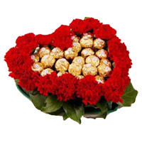 New Year Flowers to Mumbai Online cosisting of 24 Red Carnation Flowers with 24 Ferrero Rocher Chocolate in Heart Arrangement
