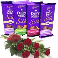 Christmas Gifts Delivery in Mumbai along with 4 Cadbury Dairy Milk Silk Chocolates with 6 Red Roses in Mumbai